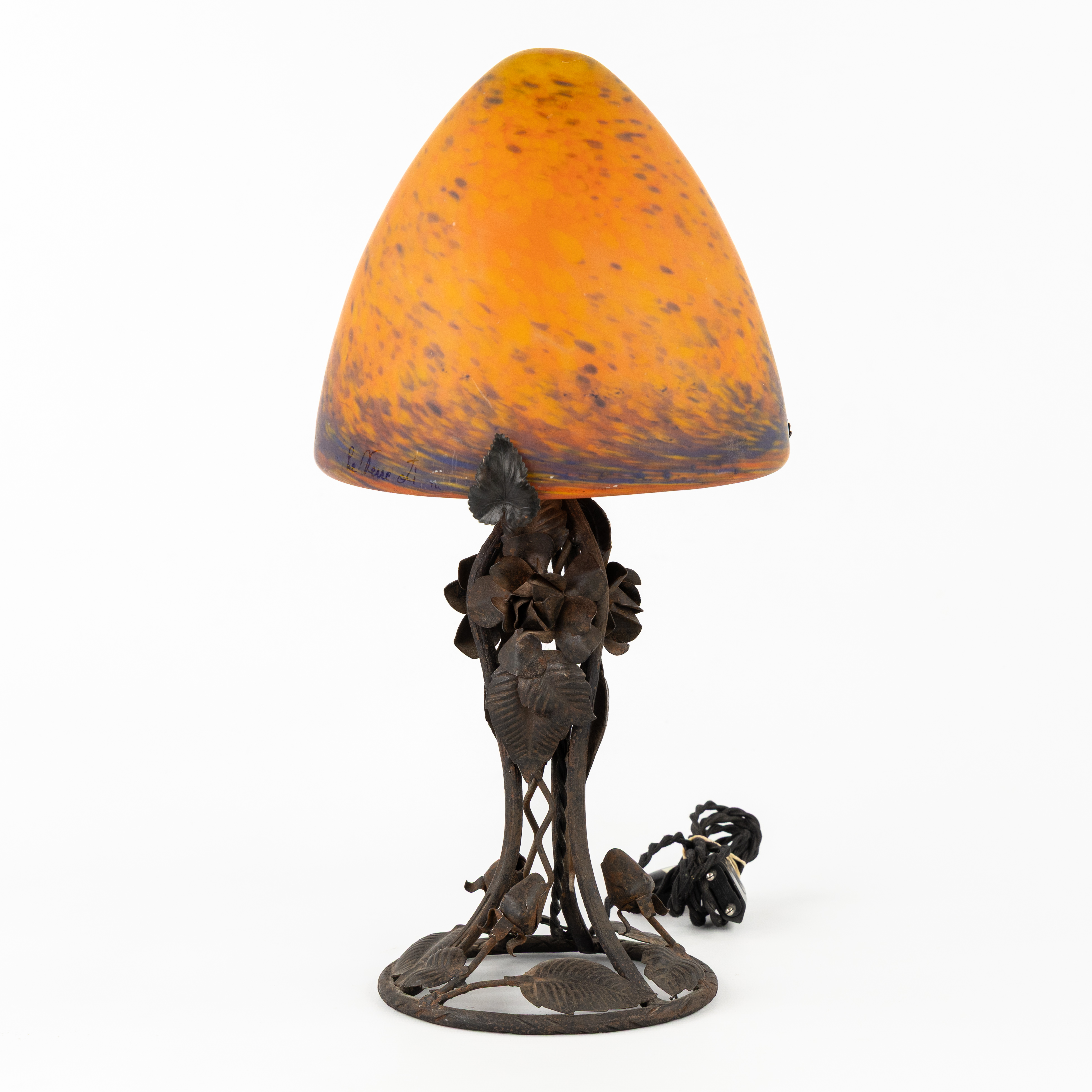 A Wrought iron table lamp with a pâte de verre 'Obus' shade, in the style of Le Verre Français. (L:21 x H:43 cm)